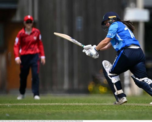 18 June 2023; Laura Delany of Typhoons bats to bring up her century during the Evoke Super Series 2023 match between Typhoons and Dragons at YMCA Sports Ground on Claremont Road, Dublin. Photo by Piaras Ó Mídheach/Sportsfile